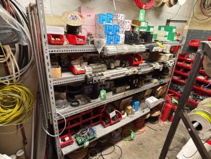 4 Shelf Racking and Contents to include a Large Quantity of New and Used Electrical Spare Parts by SCNEIDER, ANSON, WEST, NIGLON, SICK and SCAFFTAG (see Description and Photographs for further Information)