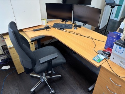 Office Furniture to room comprising Curved Desk, 2 x BISLEY Steel Double Door Cabinet, 2 x Three Drawer Pedestals, Timber Double Door Cupboard, 2 x Black Armchairs and 2 x Visitors Chairs (see Description and Photographs for further Information)