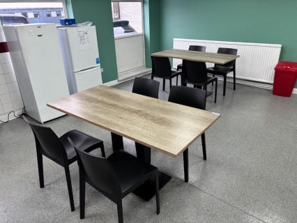 4 x Grey Canteen Tables and 16 x Black Plastic Dining Chairs