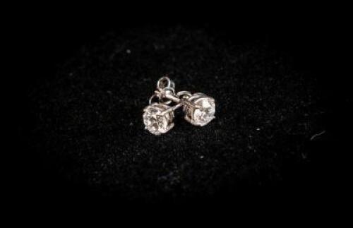 Pair of Ladies 18ct White Gold Diamond Stud Earrings; Diamond Content: circa. 1.18ct; Diamond Colour: G/H, One Slightly Off Colour Compared to the Other, One Low Fluorescence, One High; Diamond Clarity: VS2-S1; Dimensions: Approximately 5.3mm; Weight: cir